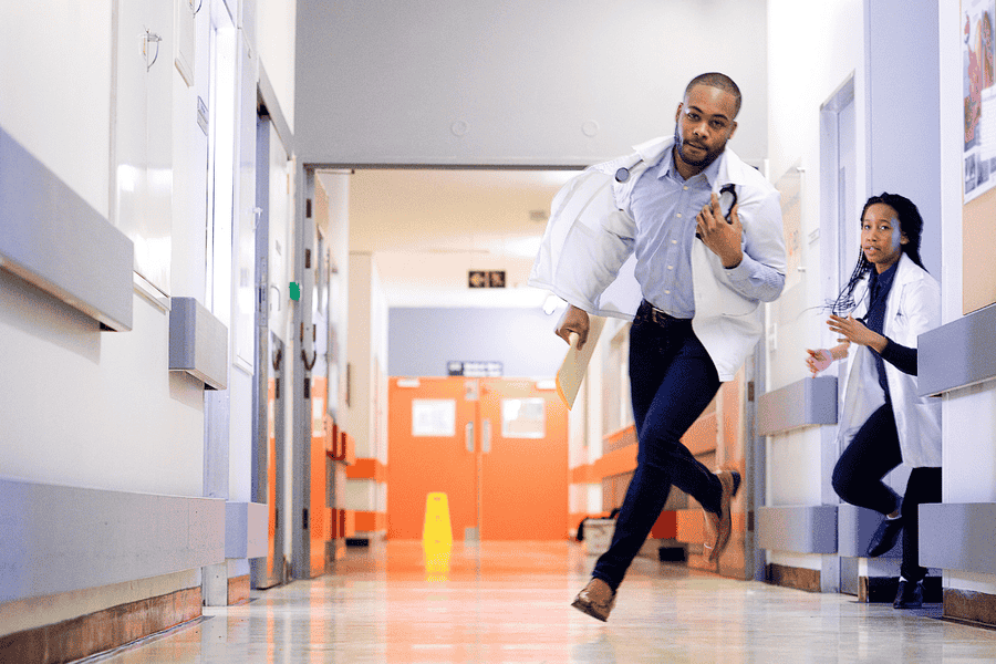 Doctors urgently responding in a hospital hallway, representing the medical risks of severe alcohol withdrawal and the need for immediate care.