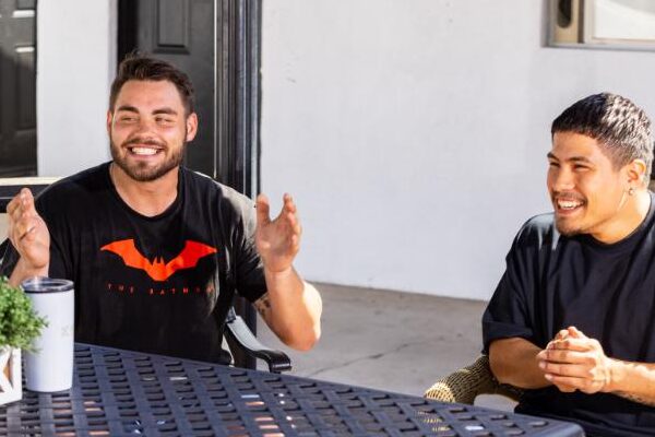 men sitting at a table in an outpatient addiction treatment group