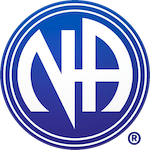 men sitting at a table in an outpatient addiction treatment group