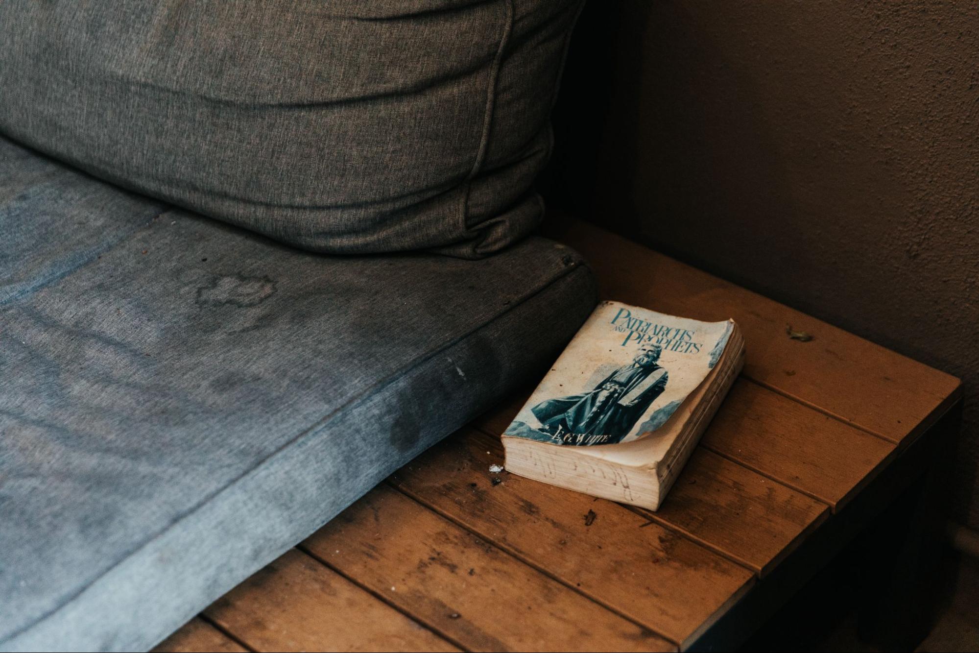 book on table next to couch