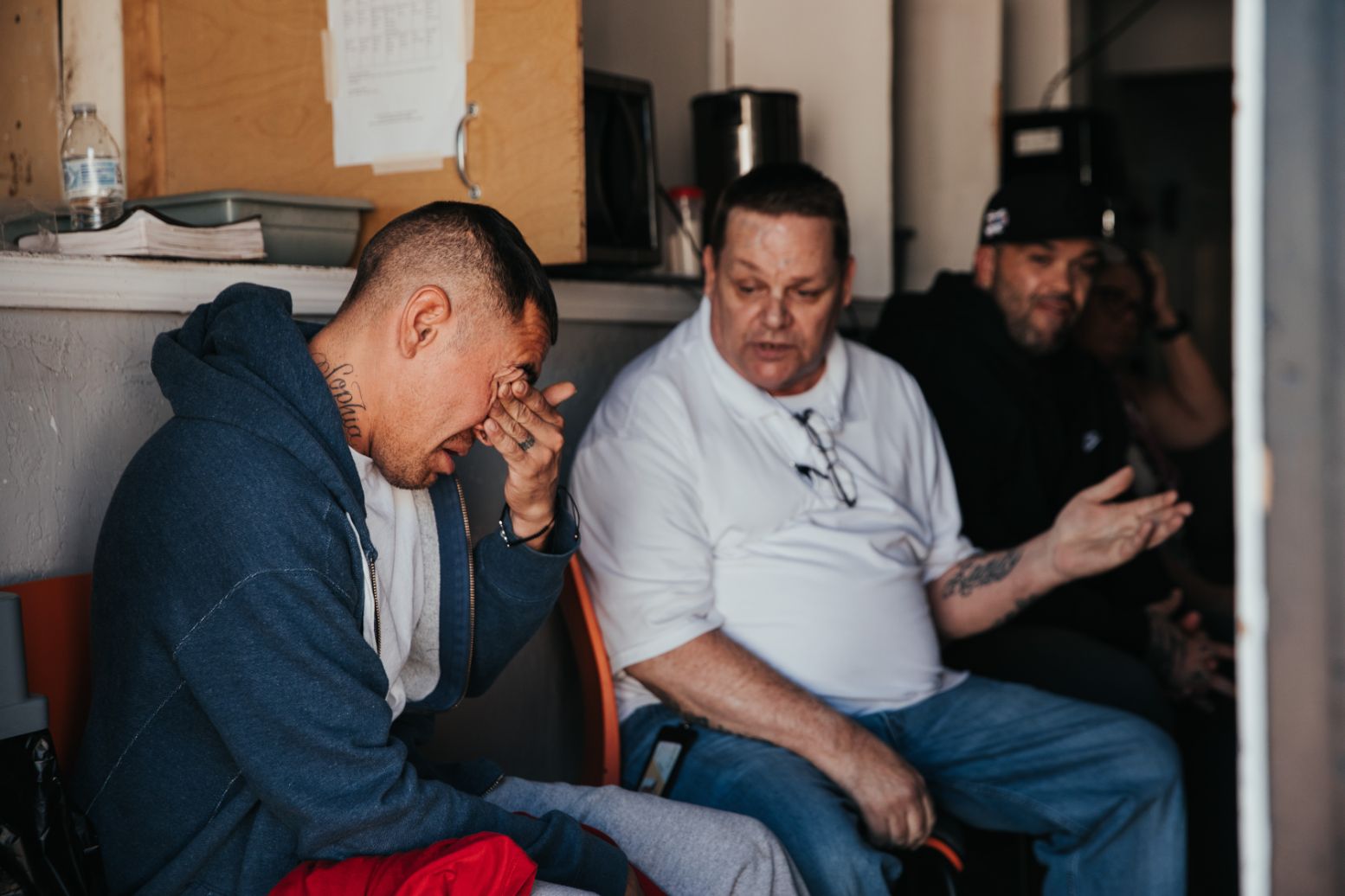 Man having a hard time talking with a fellow addict